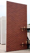panel of mixed red brick slips case study